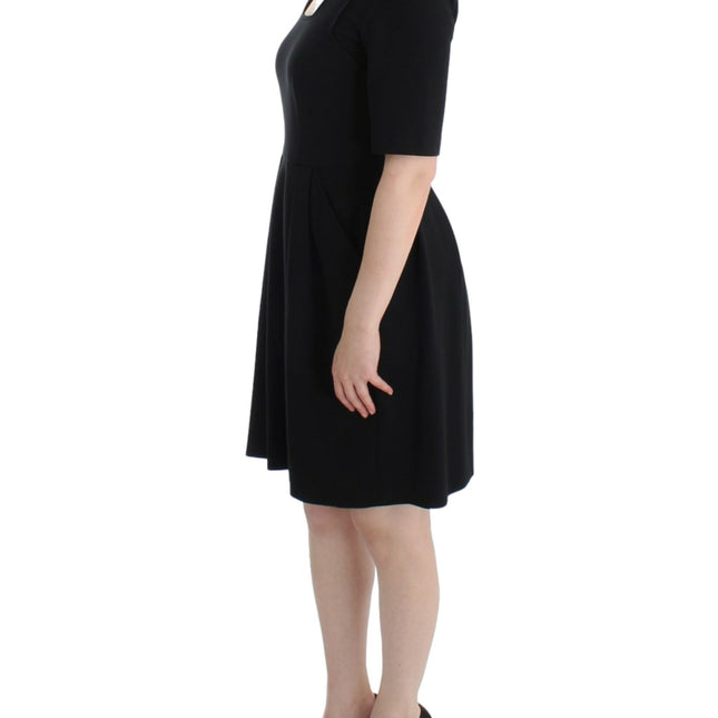 CO|TE Black short sleeve venus dress
