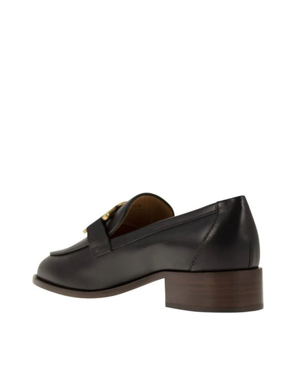 Tod's Black Calfskin Slip-On Loafers